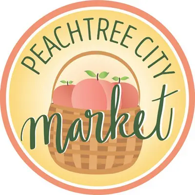 A basket of peaches with the words " peachtree city market ".