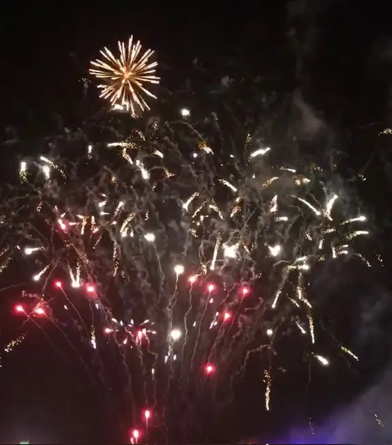 A fireworks display with lots of smoke coming from it.