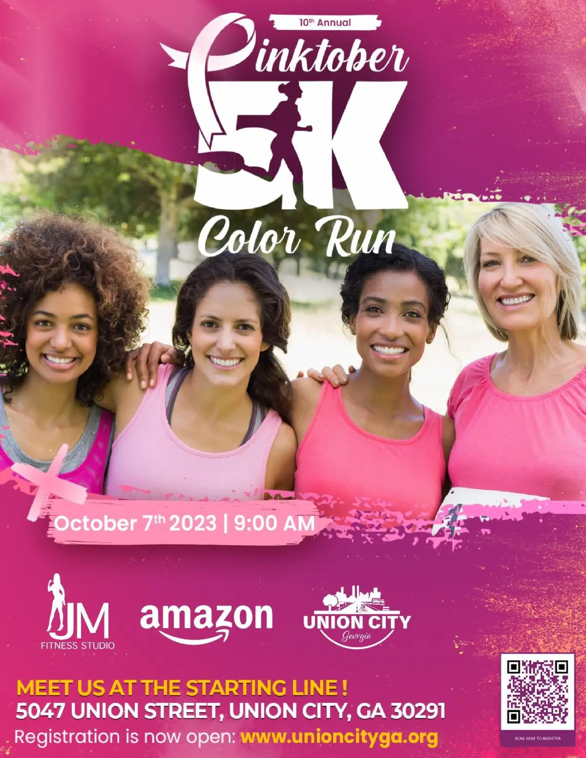 A group of women in pink shirts posing for the color run.